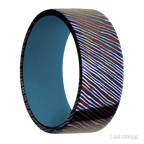 9 mm wide Flat Titanium Damascus band featuring a Royal Blue sleeve